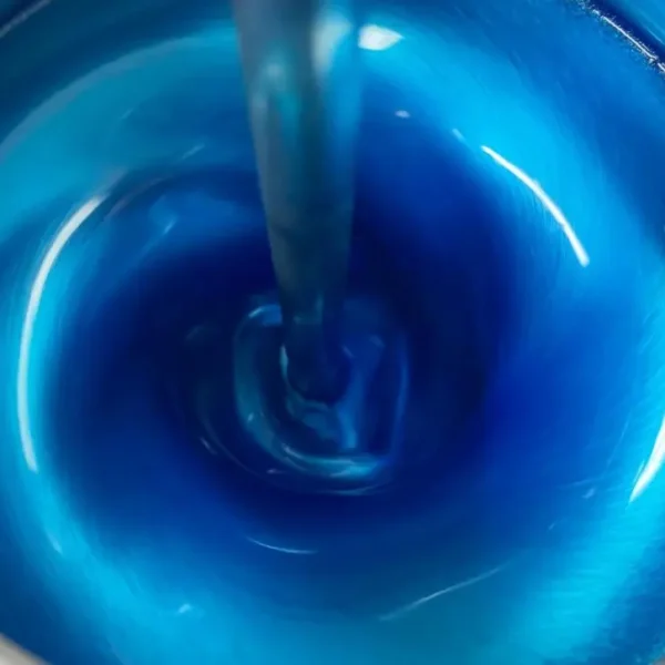 Automotive paint in a mixing machine.